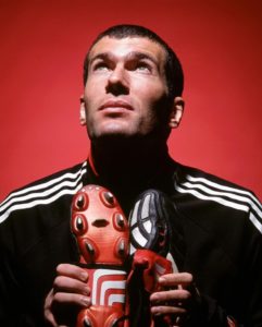 Zinedine Zidane holding a pair of Adidas Predator Mania 2002 as part or a promo shoot